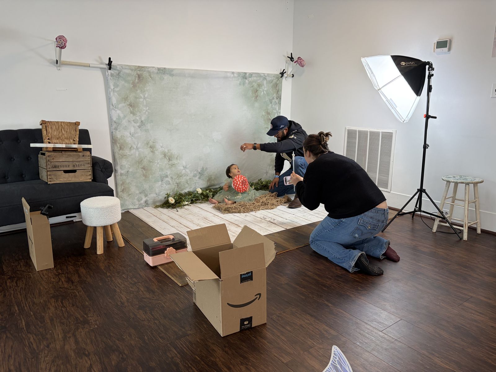 Clients taking their own photos on a styled set